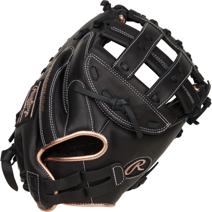 The Rawlings R9 33" Fastpitch Catcher's Mitt (R9SBCM33-24B) features durable black full-grain leather with tan accents and white stitching, plus a deep pocket and webbed top for excellent performance behind the plate.