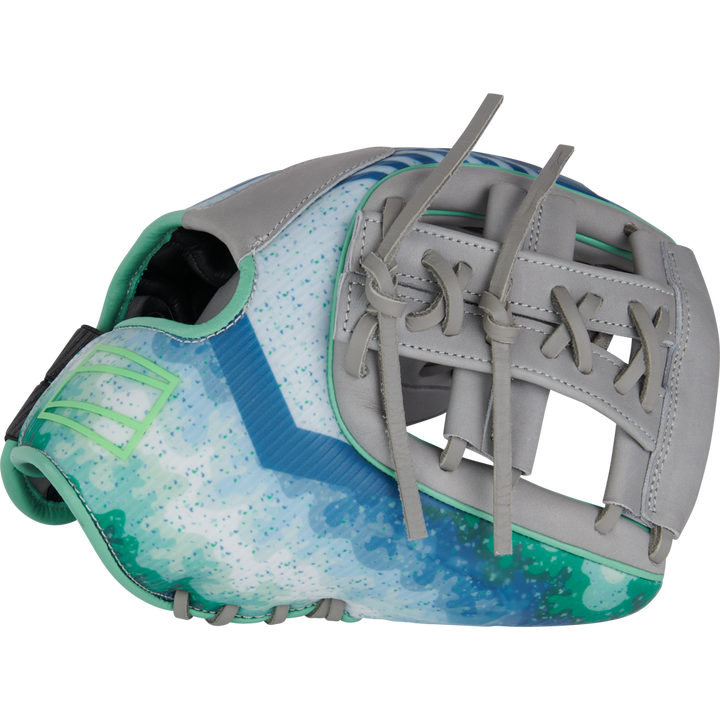 The Rawlings REV1X 11.5" Francisco Lindor GM Baseball Glove (RREVFL12G) features a vibrant blue, green, and white design with gray leather accents, teal stitching, an open web, and decorative laces inspired by Lindor’s style.