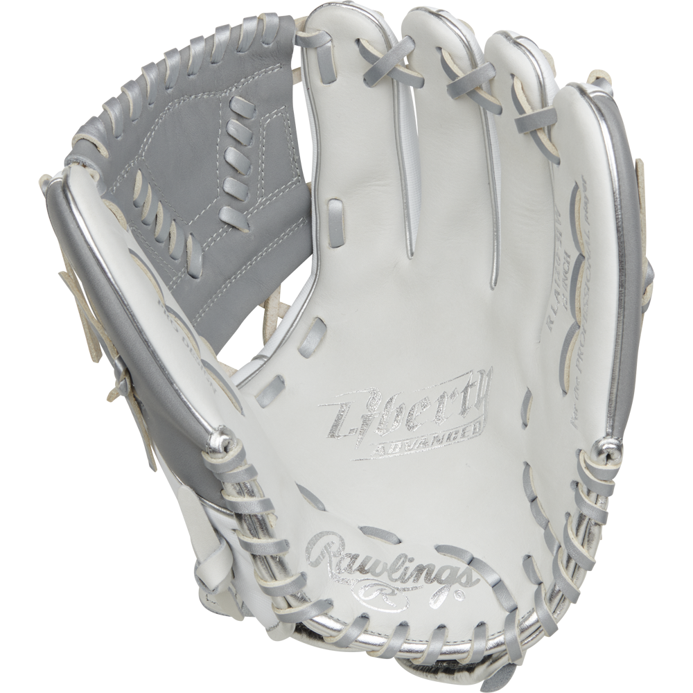 The Rawlings Liberty Advanced 12" Fastpitch Softball Glove (RRLA120-31WSS) features a white and silver design, grey lacing, "Liberty Advanced" on the palm, detailed stitching, and a webbed pocket—ideal for pitcher/infield positions.
