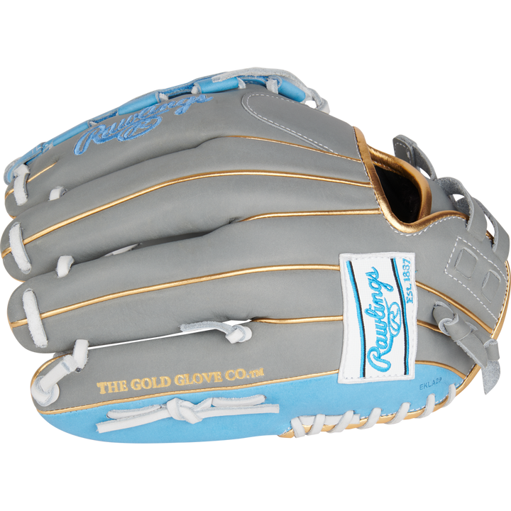 The Rawlings Liberty Advanced Color Sync 12" Fastpitch Softball Glove (RLA120-3GCB) features a gray and light blue design, tan stitching, white laces, gold "THE GOLD GLOVE CO." script, and a white Rawlings logo patch.