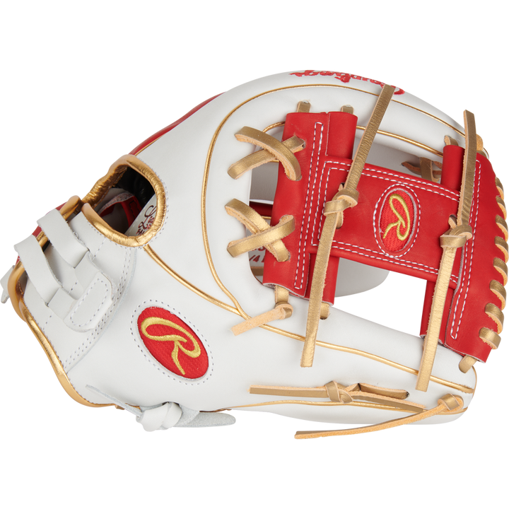 The Rawlings Liberty Advanced Color Sync 11.75" Fastpitch Softball Glove (RLA715SB-2WSG) features a white design with red and gold accents, tan laces, and the Rawlings logo in red and gold on the thumb and wrist.