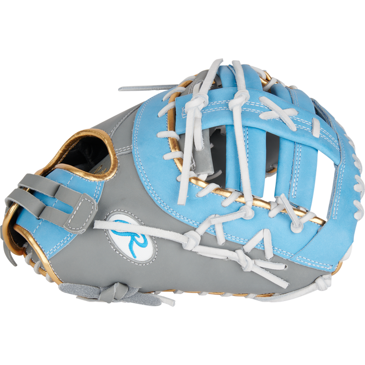 The Rawlings Liberty Advanced Color Sync 13" Fastpitch First Base Mitt (RLADCTSBGCB) features a gray and light blue design with white laces, tan trim, and a stylized R logo—ideal for players wanting a stylish and reliable first base glove.