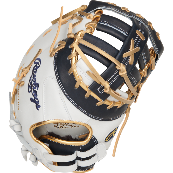 A close-up of the Rawlings Liberty Advanced Color Sync 13" Fastpitch First Base Mitt (RLADCTSBWNG) shows its white and dark navy design with tan laces, open web, and the Rawlings logo embroidered on the side.