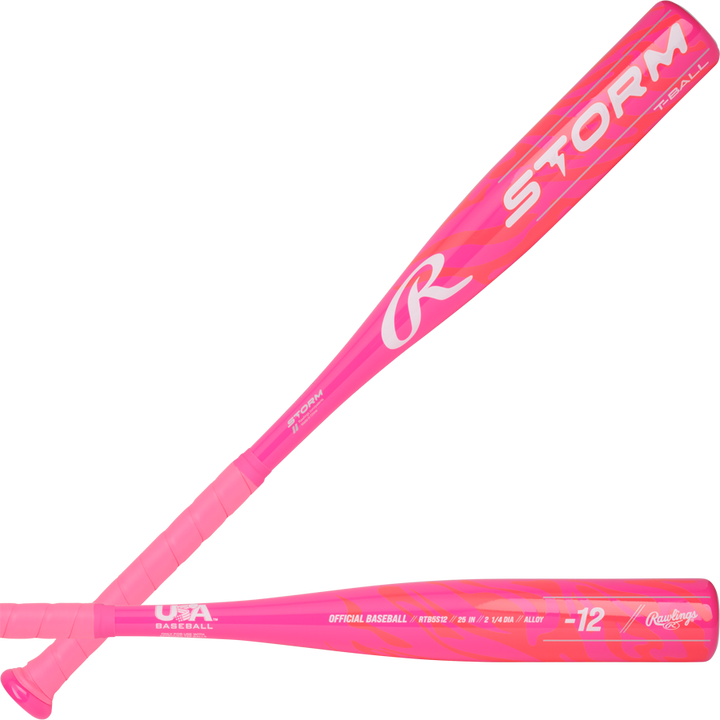 Two bright pink 2025 Rawlings Storm (-12) T-Ball bats are shown, featuring bold white STORM lettering and USA Baseball certification near the handle. Brand: Rawlings. Model: RTB5S12.