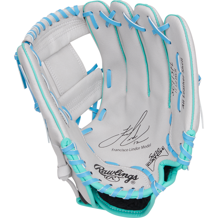 The Rawlings Sure Catch 11.5" Francisco Lindor Youth Baseball Glove (SC115FL) is white with blue and teal laces, a signature, and the Francisco Lindor Model printed on the palm.