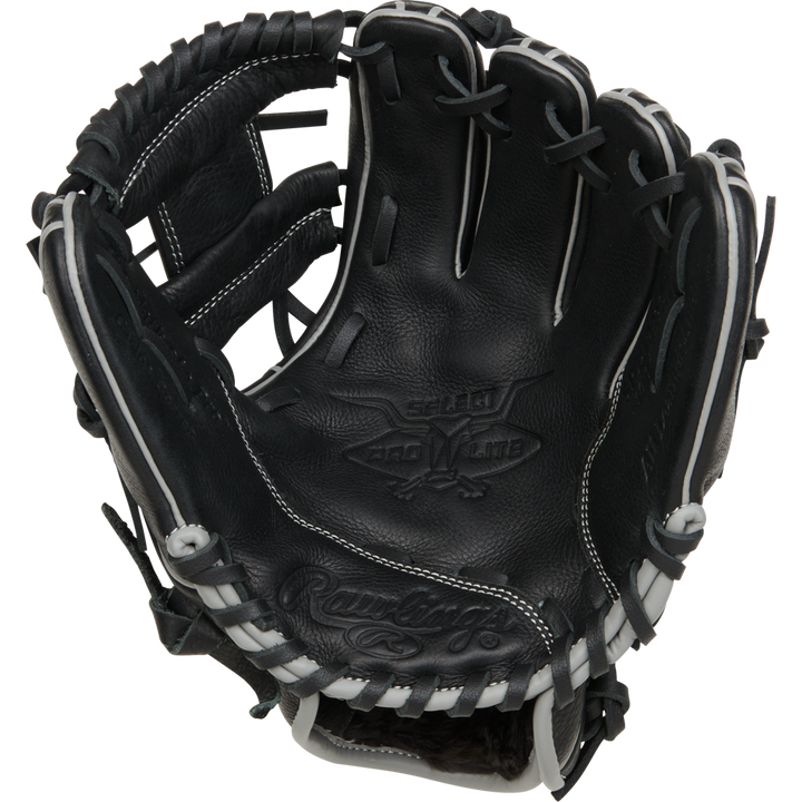 The Rawlings Select Pro Lite 10.5" RSPL105CC youth baseball glove, inspired by Carlos Correa, features a black design with white laces and prominent branding inside the palm and along the edge.
