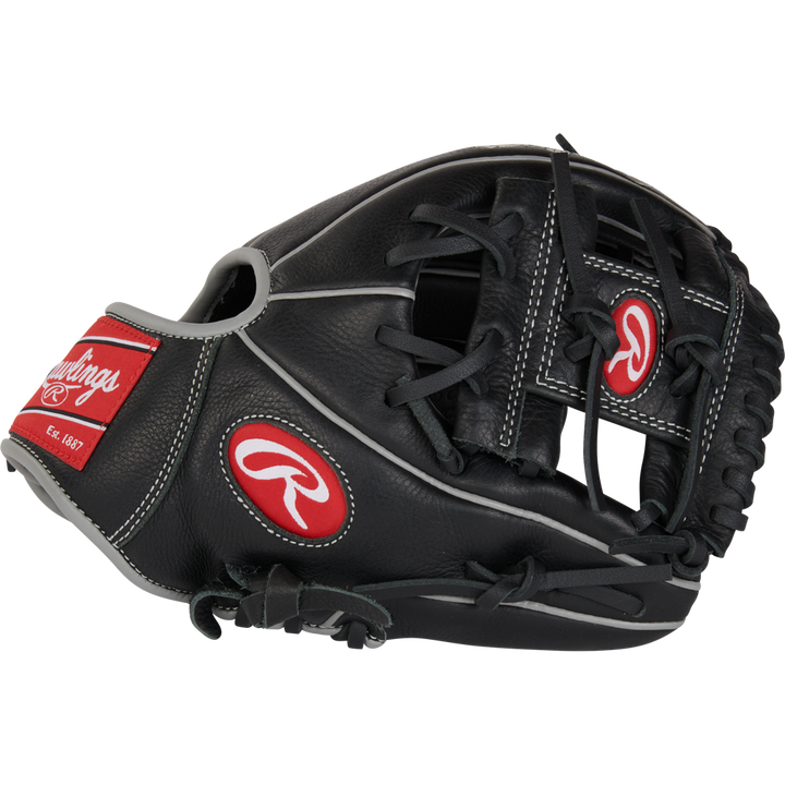 A black and gray Rawlings Select Pro Lite 10.5" Carlos Correa youth baseball glove (RSPL105CC) with red and white logos, laces, and stitching is displayed against a plain white background.