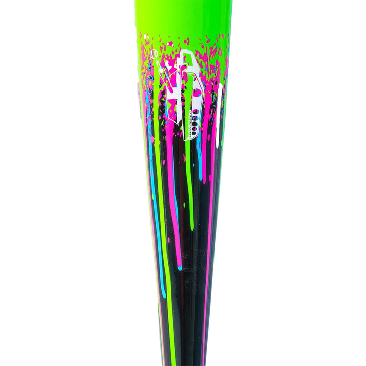 A close-up of the Soldier Sports 2026 Soldier Tank2 (-3) BBCOR Baseball Bat: BB-1-26 features vibrant neon green, pink, blue, and purple paint splatters on black with a white graphic design near the top.