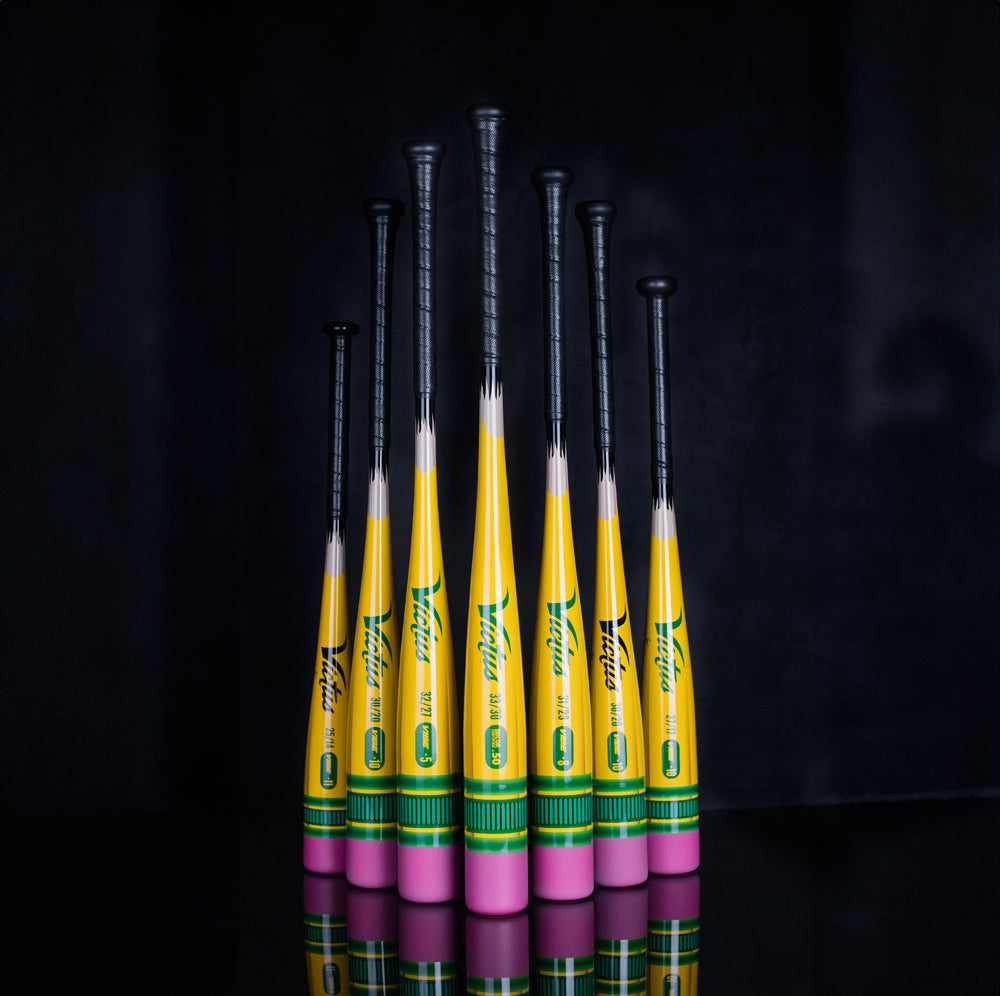 A collection of yellow and pink 2025 Victus Vibe Pencil (-8) 2 3/4" USSSA Baseball Bats by Victus, engineered for top performance and standout style.