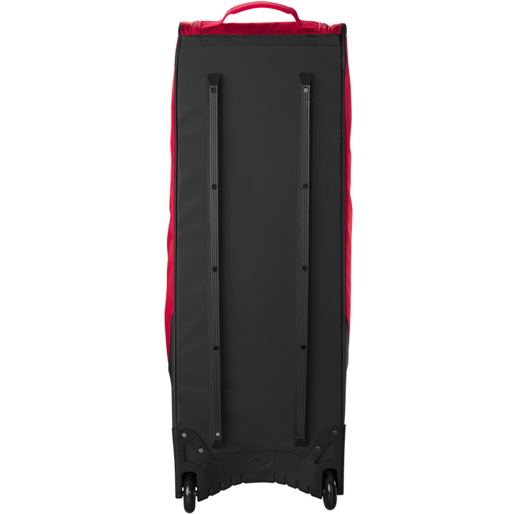 The EvoShield Takeover Wheeled Bag (WB57572) by EvoShield is a large black and red bag with two visible wheels and long black bottom support rails, perfect for transporting baseball gear.