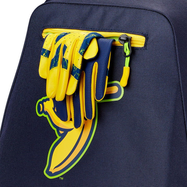 A pair of yellow and blue sports gloves is tucked into the pocket of a navy Louisville Slugger Savannah Bananas Powerized Stick Pack Backpack (WB57636), which features a graphic yellow banana.