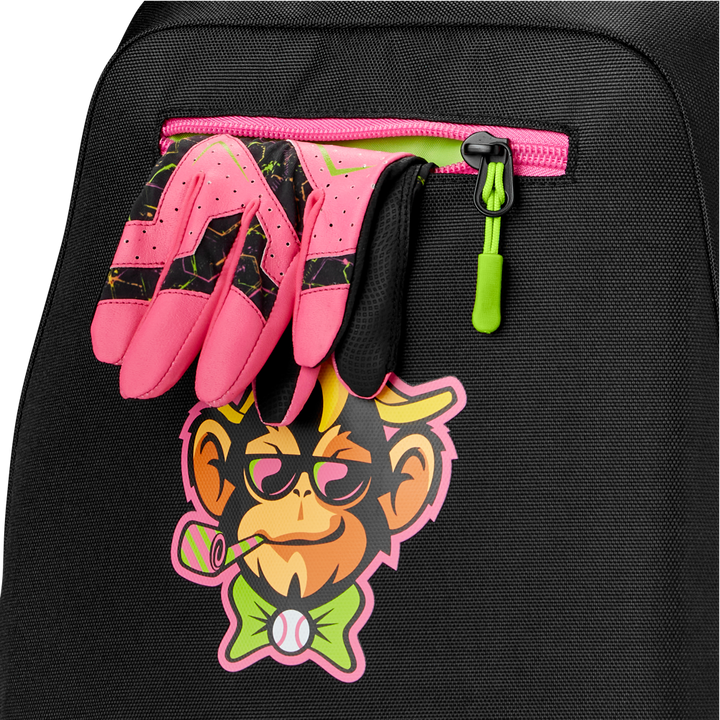 A pair of pink and black sports gloves is tucked into the zipper pocket of a Louisville Slugger Party Animals Powerized Stick Pack Backpack, which features a colorful cartoon monkey with glasses, bow tie, and bubble pipe.