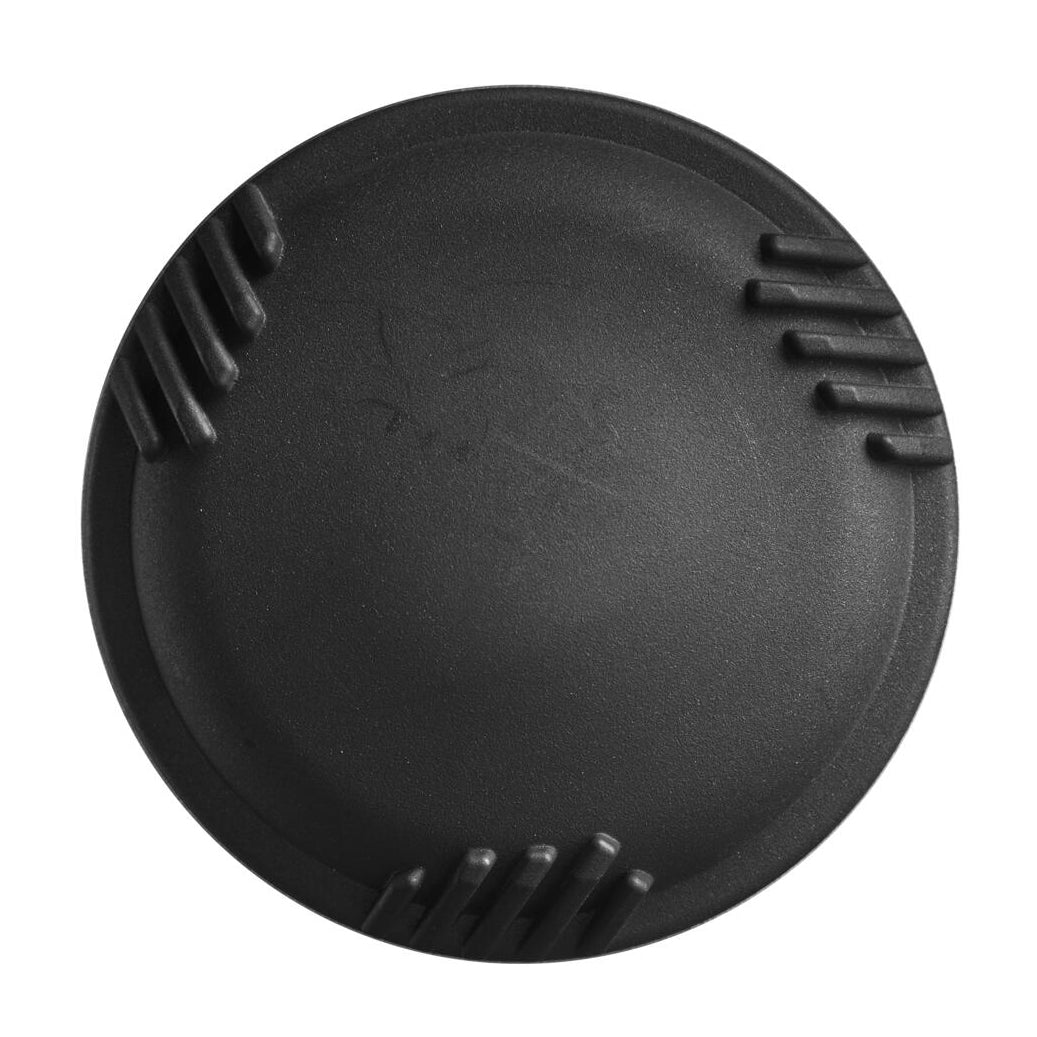A black, round camera lens cap with three ridged grip areas, echoing the precision of the DeMarini The Goods (-8) 2 3/4" USSSA Baseball Bat (WBD2470010), is shown from above on a white background.