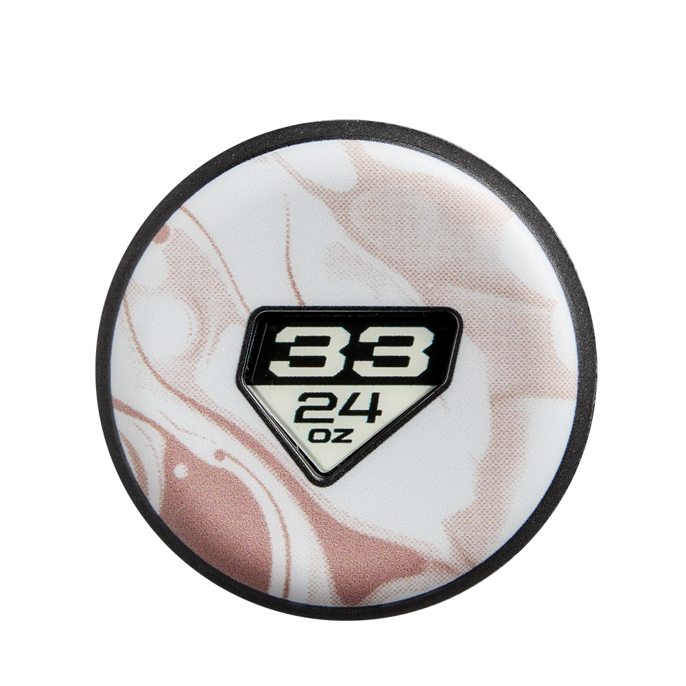 A round object with a white and pink marbled pattern and a central black-and-white emblem showing 33 over 24 oz in a home plate shape, echoing the iconic design of the 2025 DeMarini Whisper (-9) Fastpitch Softball Bat: WBD2545010 (DEMO).