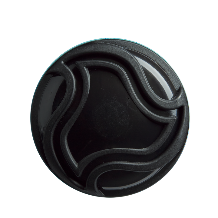 A round black container lid with raised, wavy lines—echoing the sleek X14 Alloy Barrel design of the DeMarini 2026 Omega (-3) BBCOR Baseball Bat: WBD2586010—is viewed from above against a white background.