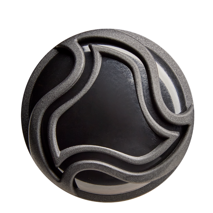 A round black object with raised, wavy lines in an abstract pattern—echoing the precision of the DeMarini The Goods (-10) 2 5/8" USA Baseball Bat: WBD2601010—viewed from above on a light background.