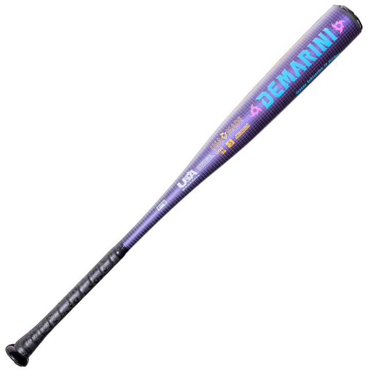 The 2026 DeMarini Voodoo One (-5) USA Baseball Bat (WBD2603010) features a purple and black design, textured black grip, vibrant blue and orange logos, and X14 Alloy text along the barrel.