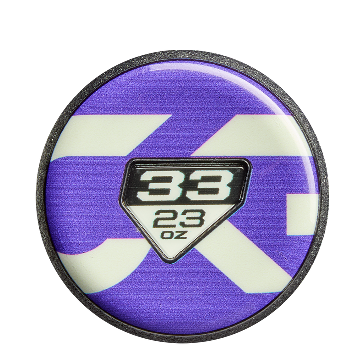 Celebrate your favorite bat with a round pin featuring a purple and white background and center badge displaying 38 above 23 oz—perfect for fans of the DeMarini CF FE (-10) Fastpitch Softball Bat: WBD2631010.