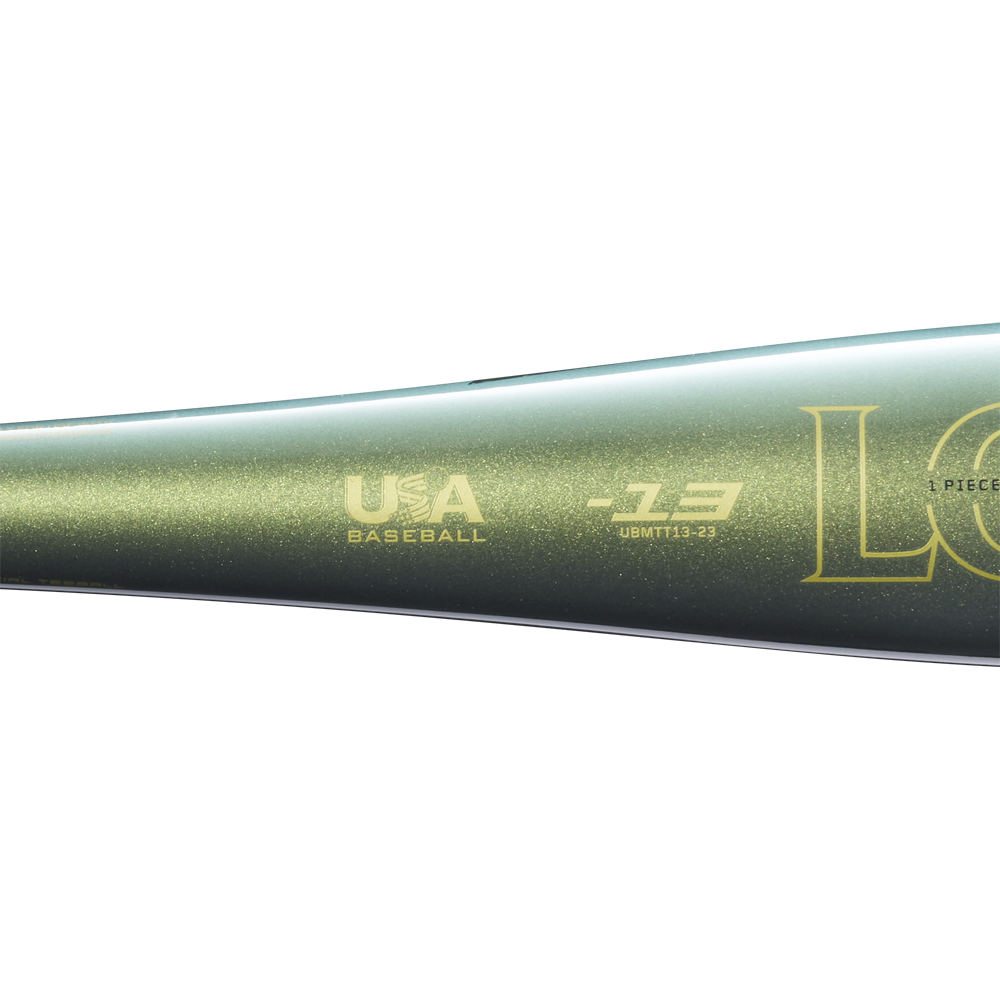 Close-up of the metallic green 2023 Louisville Slugger Meta (-13) 2 5/8" USA T-Ball Baseball Bat (WBL2667010) with gold USA Baseball and Louisville Slugger logos on its barrel, shown against a plain white background.
