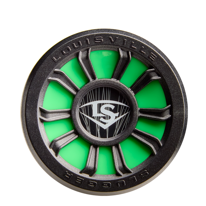 A close-up of the 2026 Louisville Slugger Dynasty (-3) BBCOR Baseball Bat shows a round, green and black design with spokes and the LS logo at the center. "Louisville" and "Slugger" appear on the rim, reflecting its quality brand.