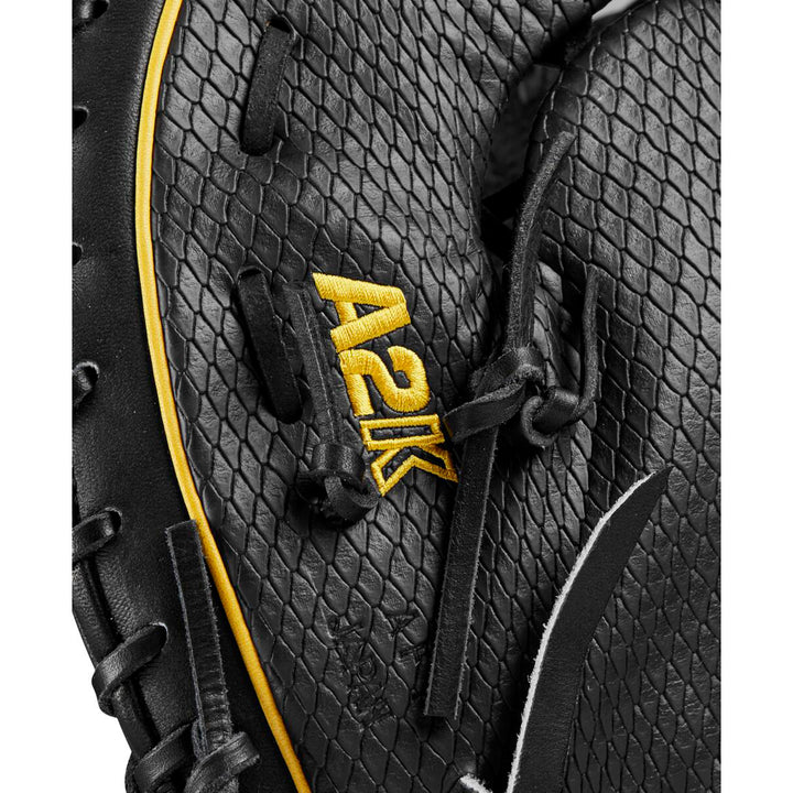 Close-up of a black Wilson A2K JAB79 12.5" Jose Abreu GM baseball first base mitt (WBW101632125) with a textured, scale-like leather pattern and yellow A2K embroidery near the black laces.