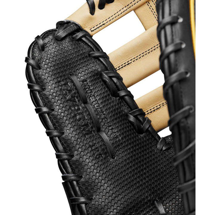 Close-up of a Wilson A2K JAB79 12.5" Jose Abreu GM first base mitt, featuring textured pocket, black stitching, partial webbing, and embossed text. Crafted from premium Pro Stock Select leather by Wilson. Model: WBW101632125.