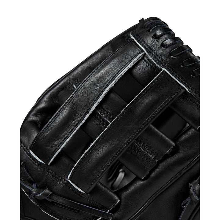 Close-up of the Wilson A2000 DW5 12" Baseball Glove (WBW10207712) in black, crafted from Pro Stock leather with detailed stitching and Dual Post Web laces on the webbing and edges.