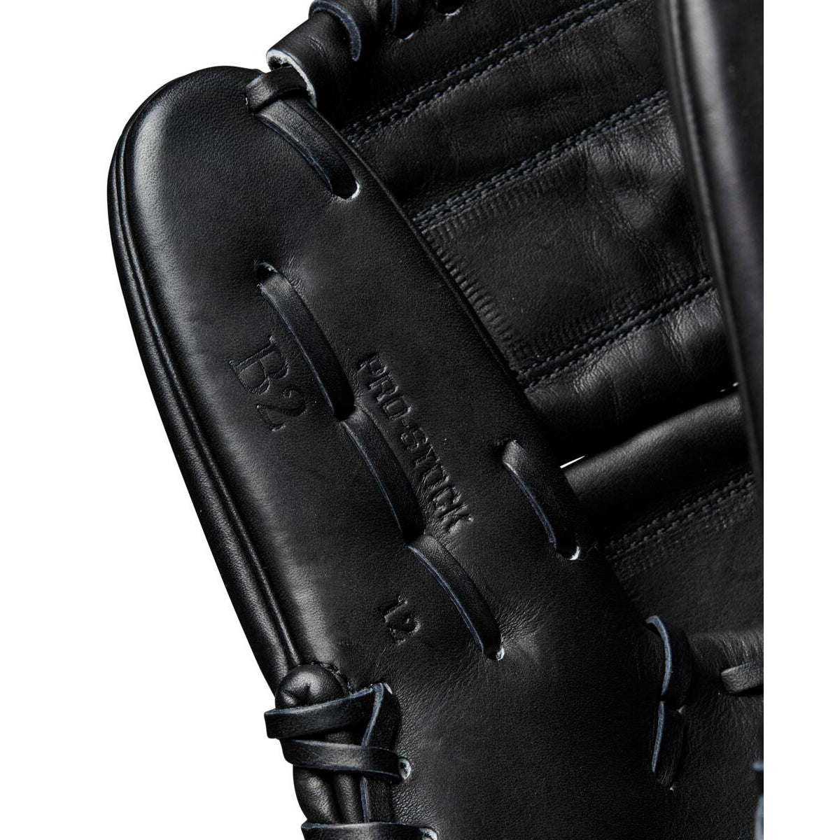 Close-up of the Wilson A2000 B2 12" Baseball Glove (WBW10208012) in black, crafted from Pro Stock leather with detailed stitching and embossed Pro Stock and D2 markings. Premium pitcher’s glove by Wilson.