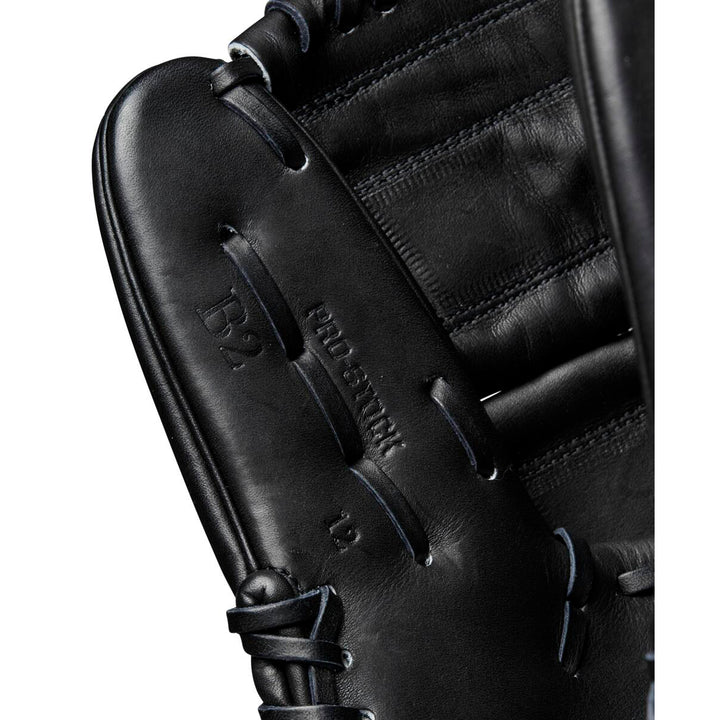 Close-up of the Wilson A2000 B2 12" Baseball Glove (WBW10208012) in black, crafted from Pro Stock leather with detailed stitching and embossed Pro Stock and D2 markings. Premium pitcher’s glove by Wilson.