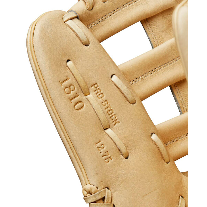 Close-up of the Wilson A2000 1810 12.75" Baseball Glove: WBW1020881275, crafted with premium Pro Stock® leather and featuring embossed "1810 PRO STOCK 12.75" text on the palm—a top-tier outfield glove by Wilson.