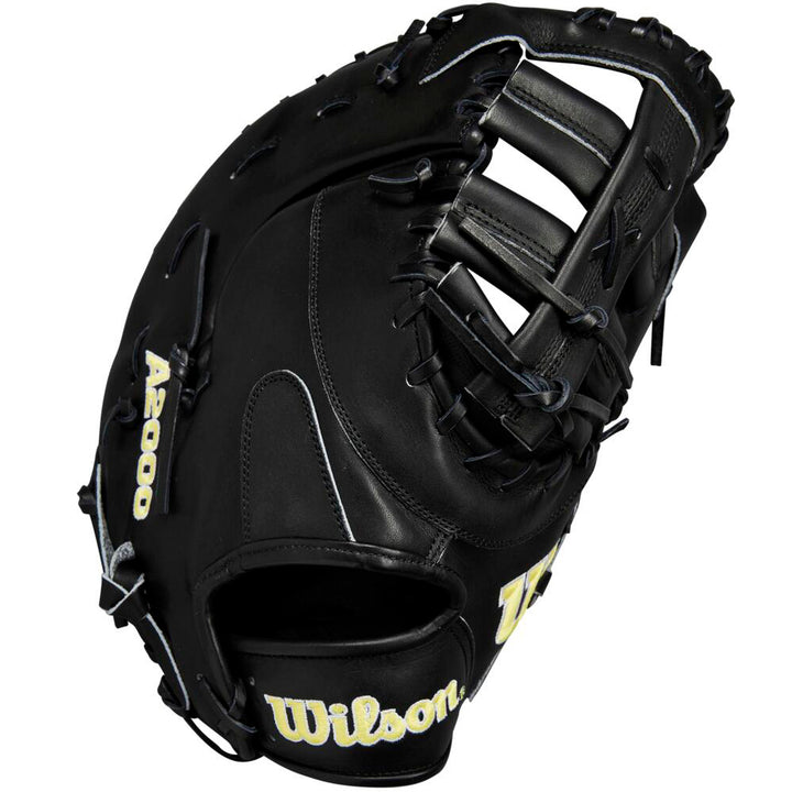 The Wilson A2000 1679 12.5" First Base Mitt (WBW102095125) is a black Pro Stock leather glove with yellow branding, lacing details, and an open web design, made by Wilson.
