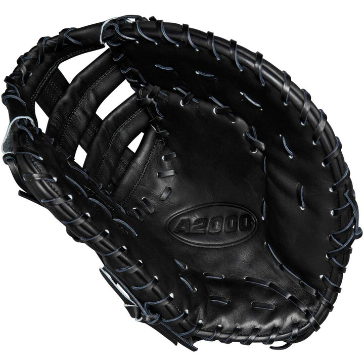 The Wilson A2000 1679 12.5" Baseball First Base Mitt (WBW102095125) features black Pro Stock leather, visible stitching, and the model number embossed in the center of the pocket.