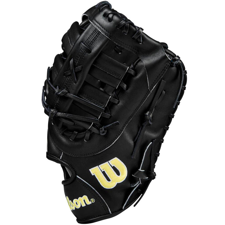 The Wilson A2000 1679 12.5" First Base Mitt (WBW102095125) by Wilson features a black design, yellow W logo, Pro Stock leather, detailed stitching, and intricate lacing.