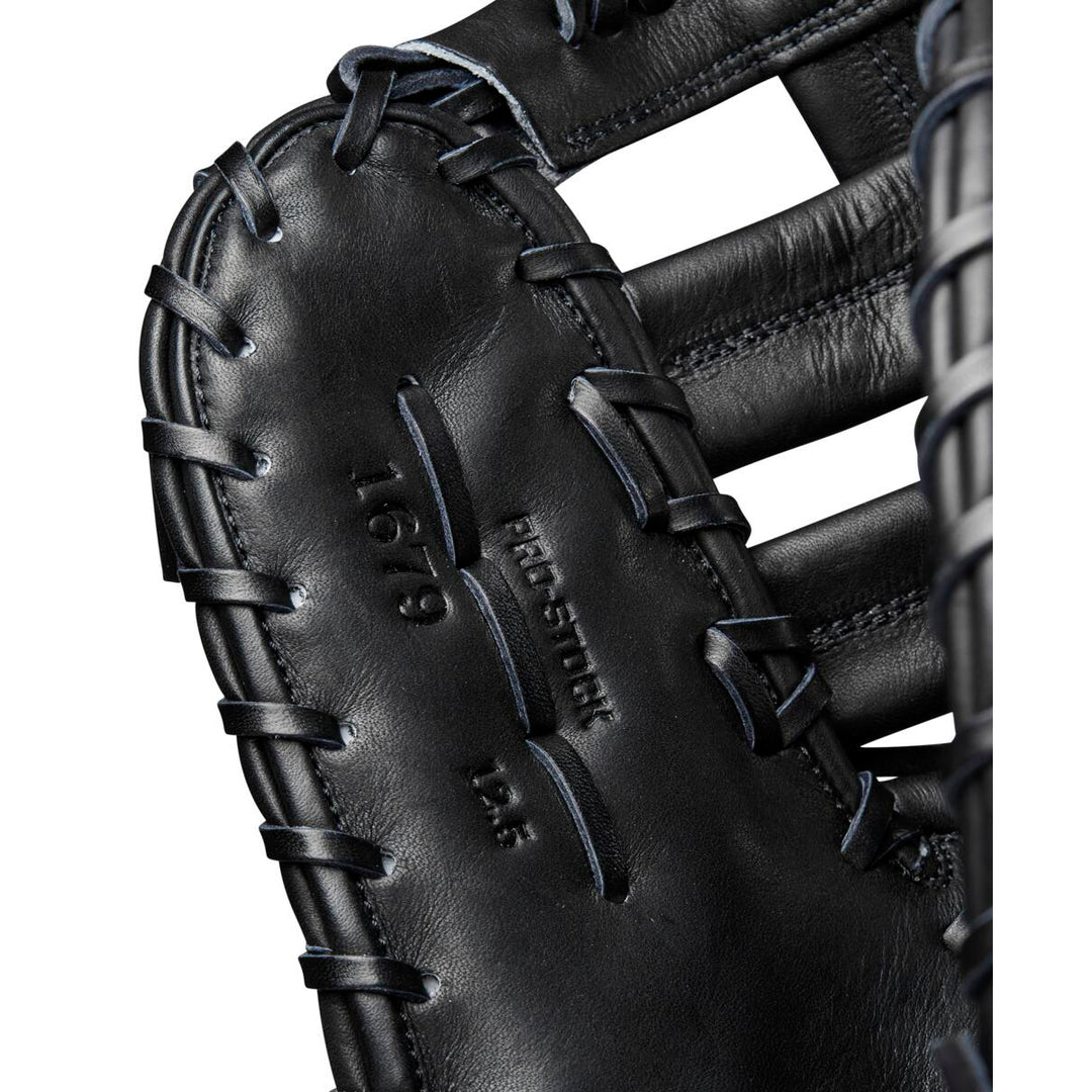 Close-up of the Wilson A2000 1679 12.5" First Base Mitt (WBW102095125), showing detailed stitching, embossed “PRO STOCK 1679 12.5” text, a woven web design, and durable Pro Stock leather.