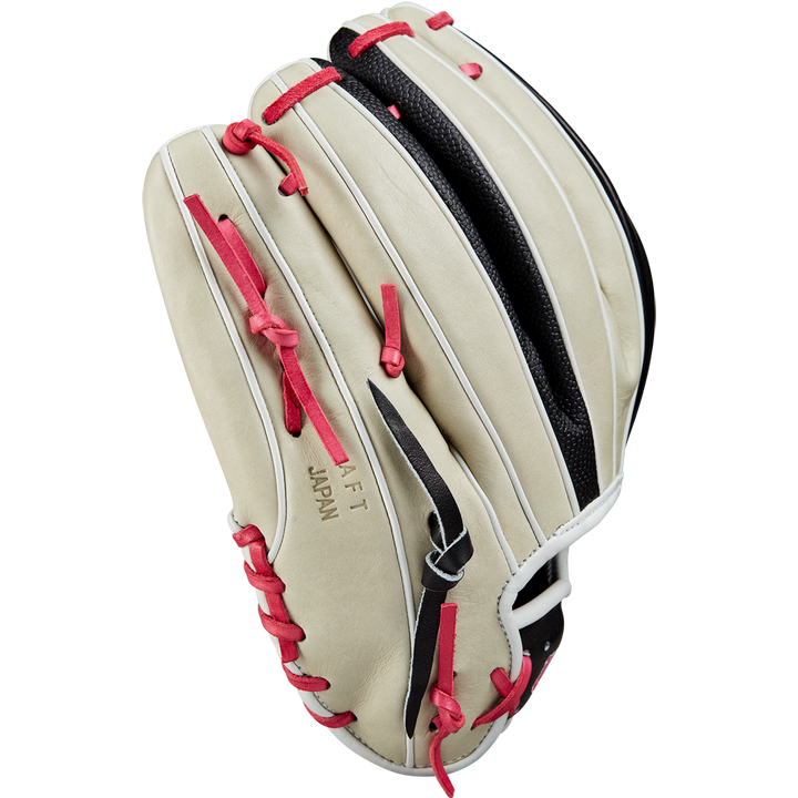 The Wilson A2K 1724 11.75" Baseball Glove (GOTM June 2024) in beige with red laces, black webbing, and white trim, made from Pro Stock Select leather, displays JAPAN and AFT embossed on the side against a plain white background.