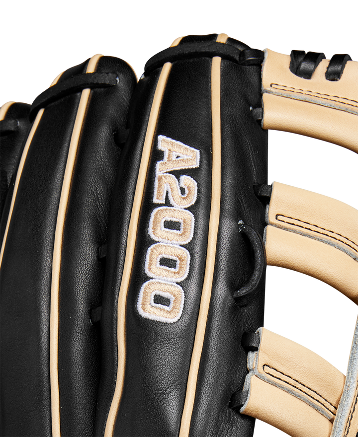 Close-up of the Wilson A2000 1810 12.75" Baseball Glove, Winter 2024 model (WBW1025271275), black and tan with white stitching, made from premium Pro Stock leather, featuring embroidered details and finely crafted laces.