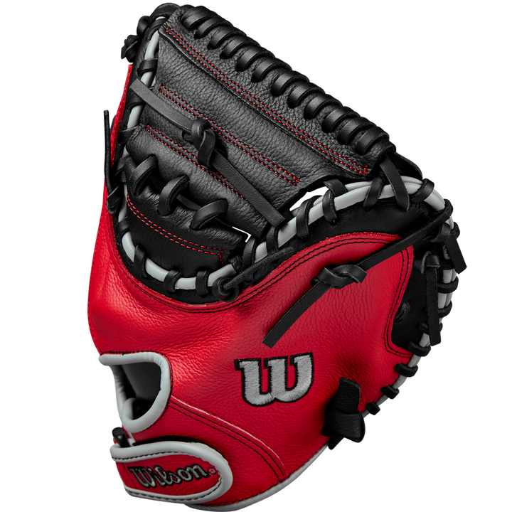 The Wilson A500 32" Baseball Catcher's Mitt: WBW10254632 in red and black with white accents, detailed stitching, and an open web design is displayed against a plain white background.