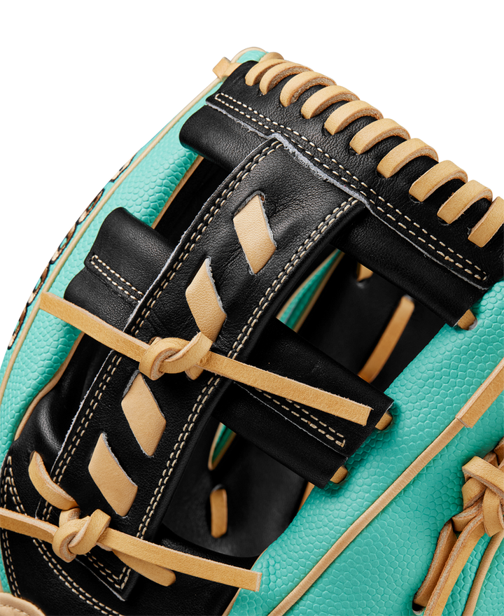 Close-up of the Wilson A2000 1716SS 11.5" Baseball Glove (SPRING 2025: WBW102547115) featuring turquoise Pro Stock leather, black and tan lacing, and detailed stitching that showcases the glove’s quality craftsmanship.