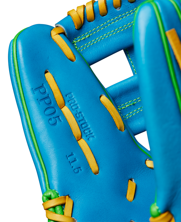 Close-up of the Wilson A2000 PP05 11.5" Baseball Glove (WBW102548115), featuring Pro Stock® leather, yellow laces, green stitching, and embossed text: PP05, PRO STOCK, and 11.5 on the palm.