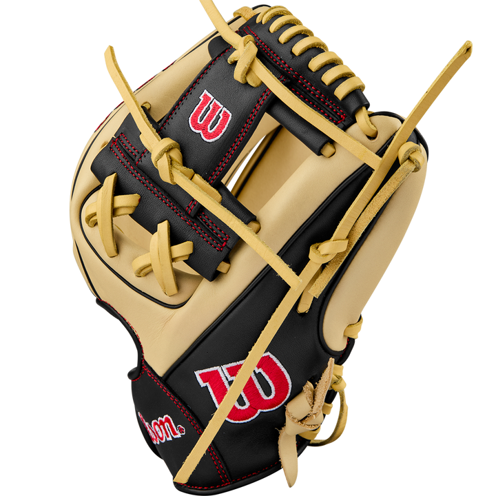 A Wilson A900 PF115 11.5" baseball glove in tan and black, featuring red stitching and a white Wilson logo on the thumb and wrist, is displayed against a plain white background.