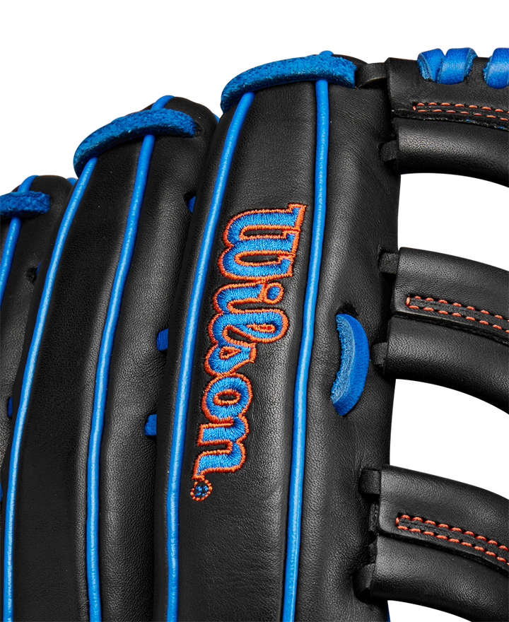 Close-up of the black Wilson A1000 PF1892 12.25" Baseball Glove (WBW1025831225) in Full Grain leather, with blue laces, red stitching, and the Wilson logo embroidered in red and blue.