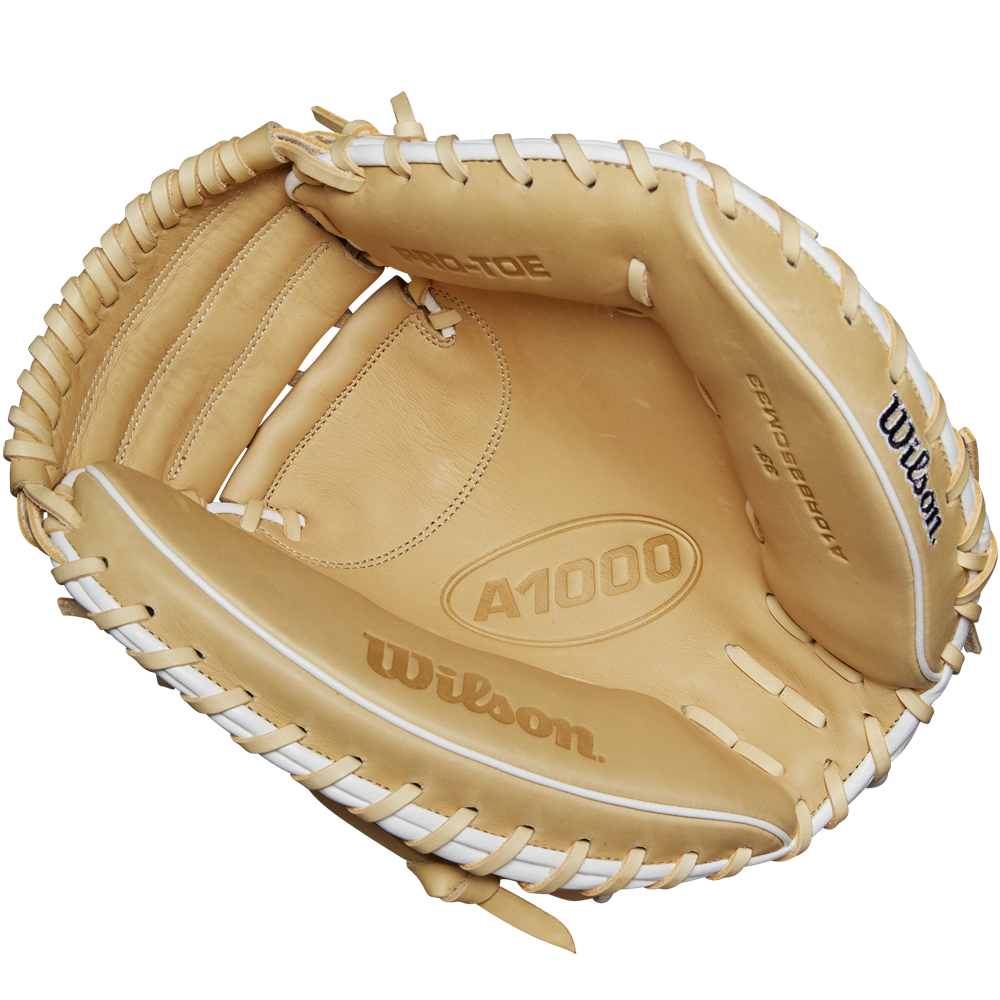 The Wilson A1000 CM33 33" Baseball Catcher's Mitt (WBW10258933) by Wilson, shown in tan with white laces, highlights its open interior, brand details, and premium Full Grain leather construction.