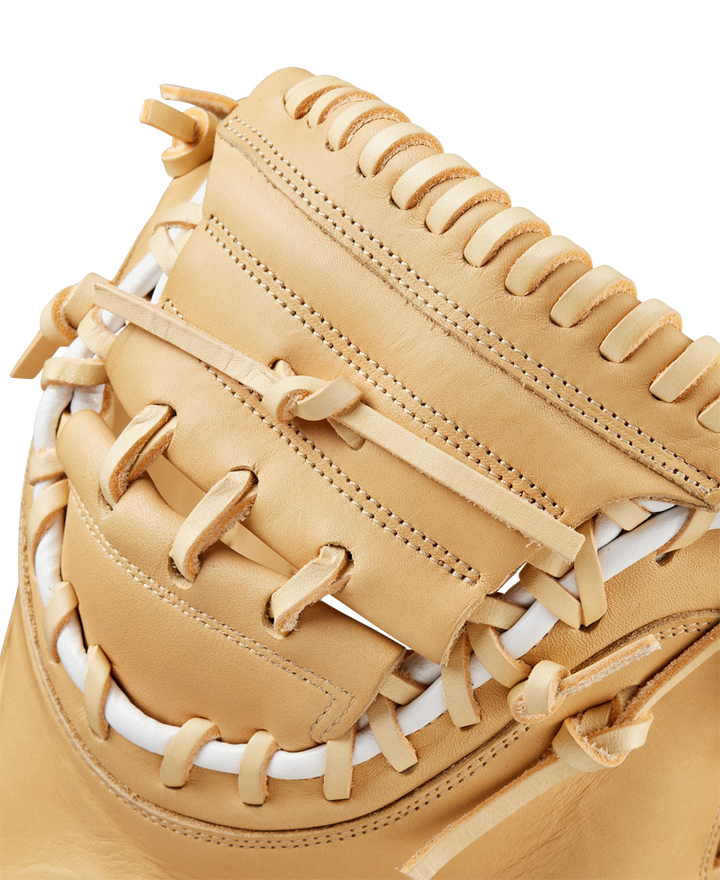 Close-up of the Wilson A1000 CM33 33" Baseball Catcher's Mitt (WBW10258933) shows detailed lacing, stitching, white leather accents, and the quality craftsmanship this full-grain leather Wilson mitt is known for.