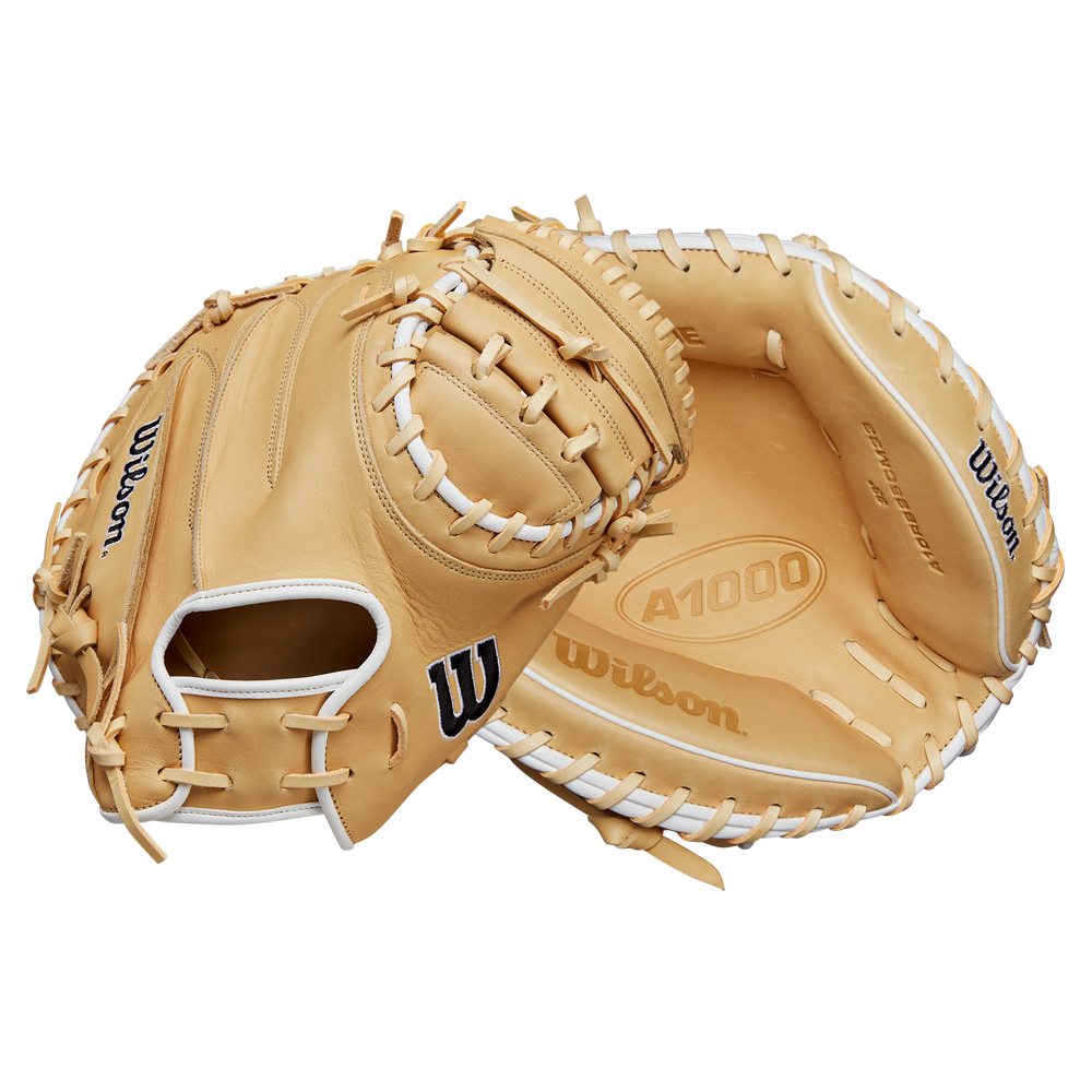 The Wilson A1000 CM33 33" Baseball Catcher's Mitt (WBW10258933) by Wilson is shown in tan with white laces from two angles: one highlights the exterior and logo, the other shows the deep pocket and A1000 marking inside.