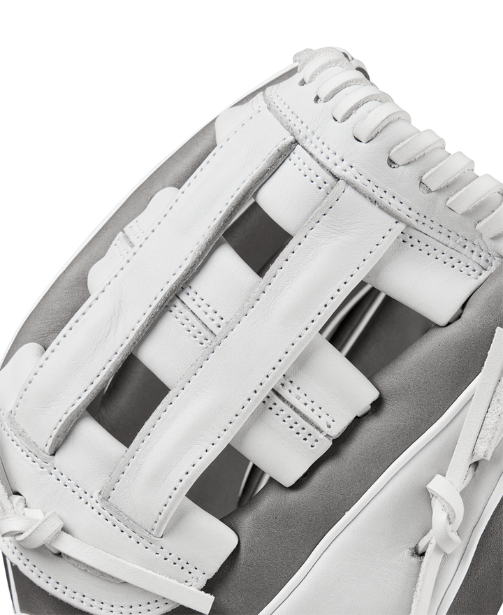 Close-up of the Wilson A1000 IF12 12" Fastpitch Glove (WBW10259112) by Wilson, featuring white full grain leather, detailed stitching, and woven laces—ideal as an infield glove—shown against a plain background.