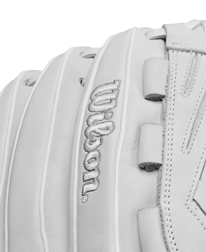 Close-up of the Wilson A1000 V125 12.5" Fastpitch Glove (WBW102594125) in white full grain leather, highlighting detailed stitching and the embroidered Wilson logo.