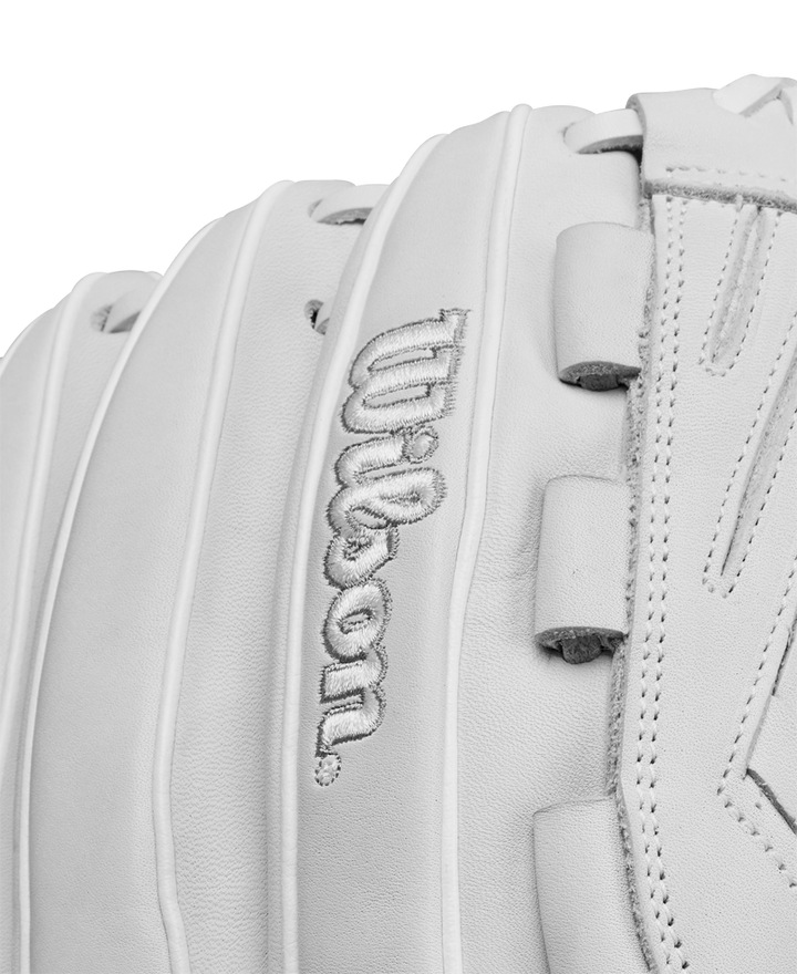 Close-up of the Wilson A1000 V125 12.5" Fastpitch Glove (WBW102594125) in white full grain leather, highlighting detailed stitching and the embroidered Wilson logo.