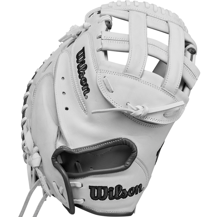 The Wilson A1000 CM33 33" Fastpitch Catcher's Mitt (WBW10260033) features a white design with black stitching, Wilson branding, open web, visible leather lacing, and is made from durable full grain leather.