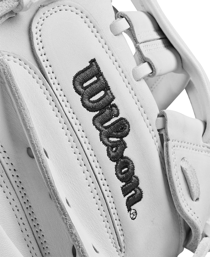 Close-up of the Wilson A1000 CM33 33" Fastpitch Catcher's Mitt, crafted from white full grain leather with black-stitched Wilson branding. The glove’s stitching and texture are detailed, showcasing its classic catcher’s mitt design.