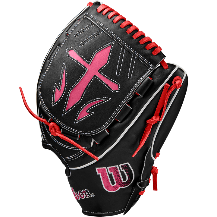 The Wilson A2K B23 12" Baseball Glove (FALL 2024) features black Pro Stock leather, red and pink accents, white stitching, a large pink cross on the back, red laces, and the Wilson logo.